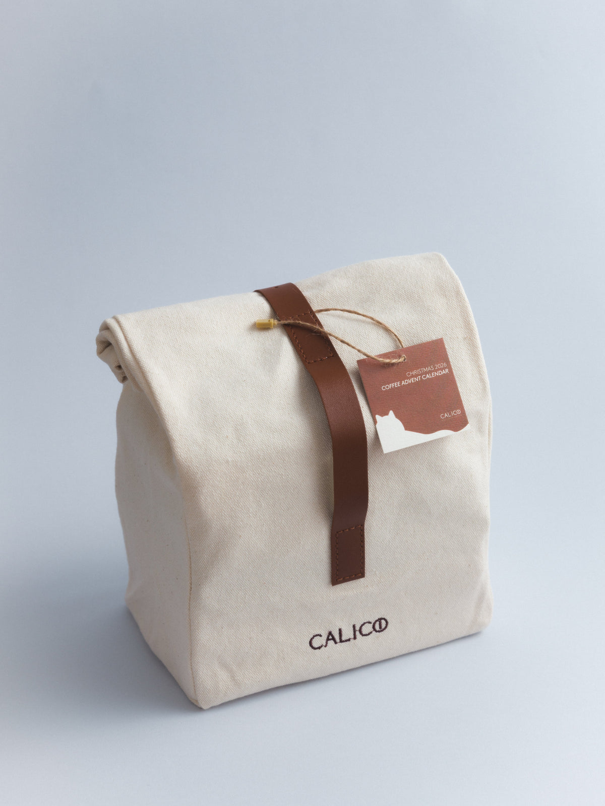 Front view of the closed Calico Christmas Calendar canvas bag