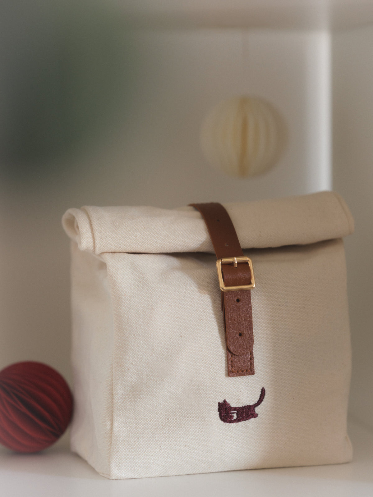 Calico Christmas Calendar canvas bag on a shelf